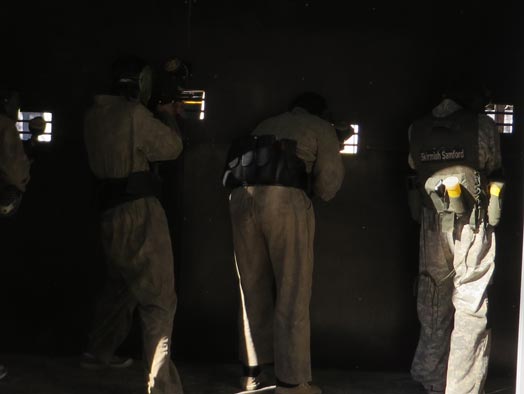 Paintball Players shooting from inside the Battle Bunker